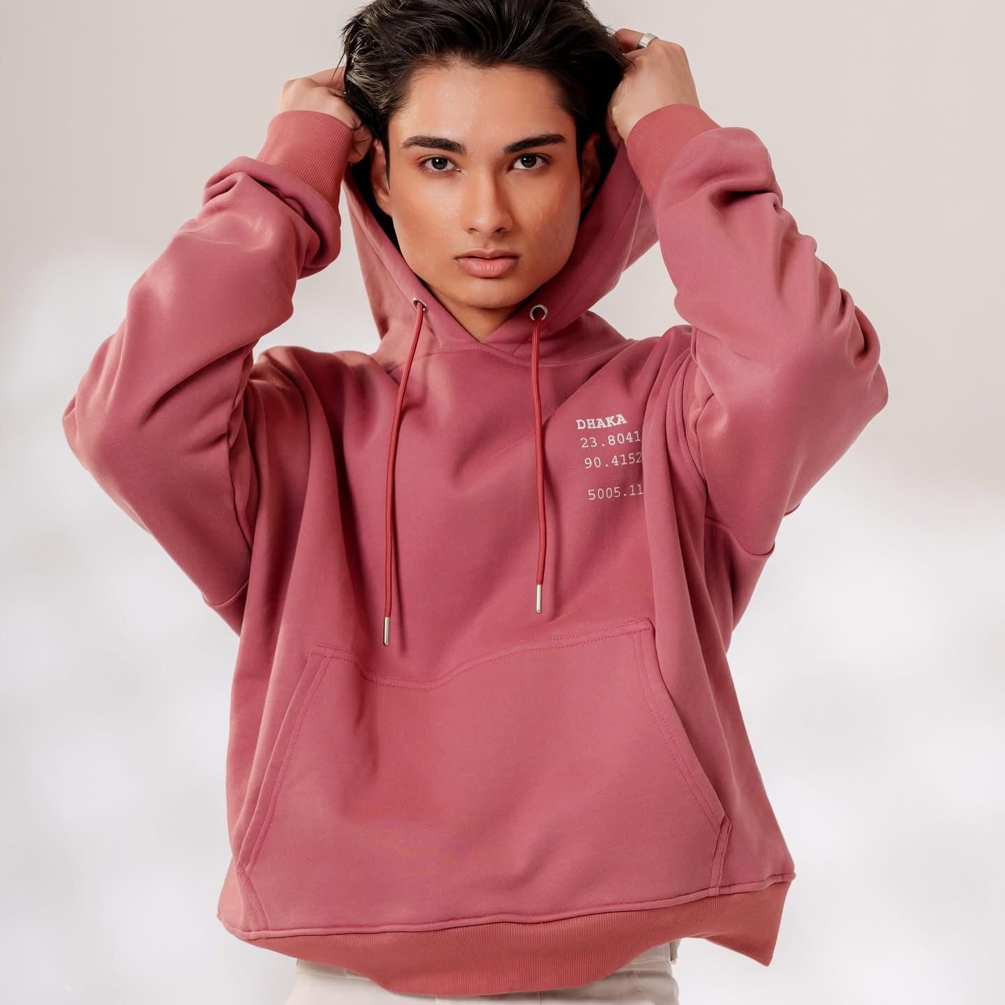 Dusty-rose heavyweight fleece hoodie, front view on model, hood up