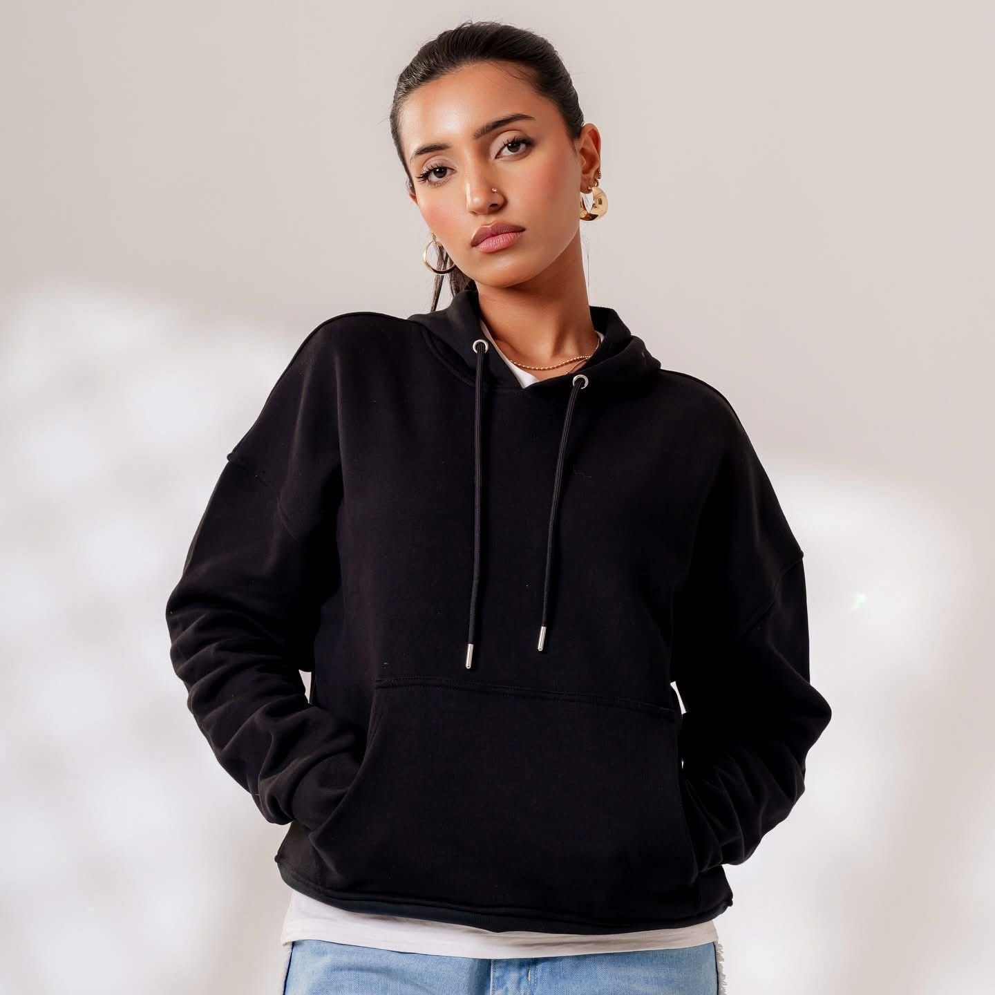 Black fleece hoodie, front view on model